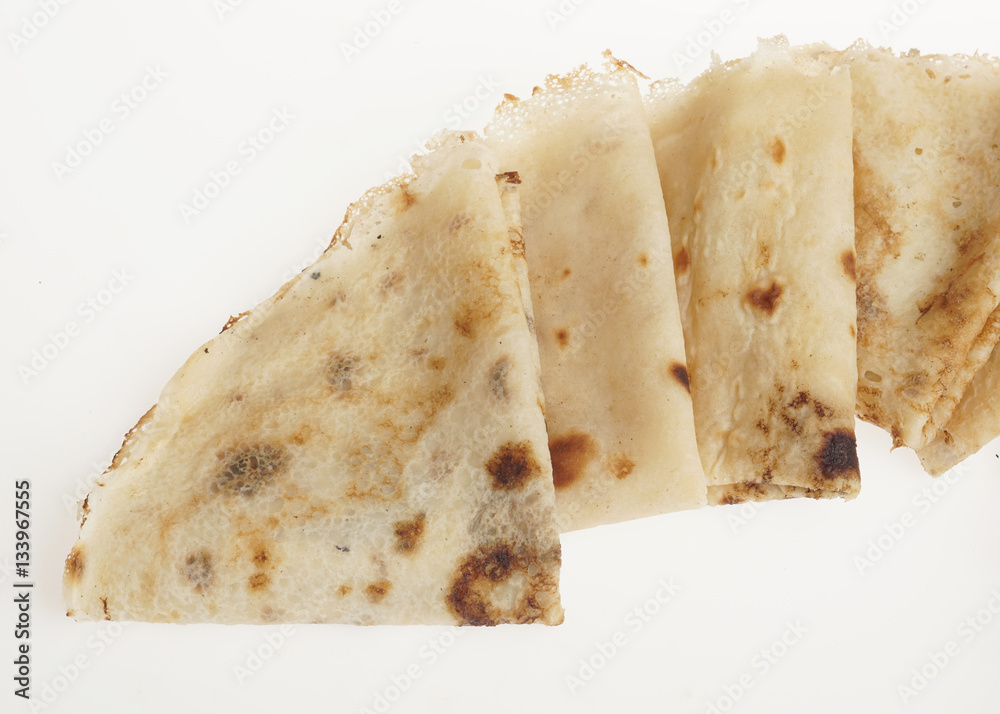 Freshly baked rolled blinis or crepes isolated Freshly baked rolled blinis or crepes isolated