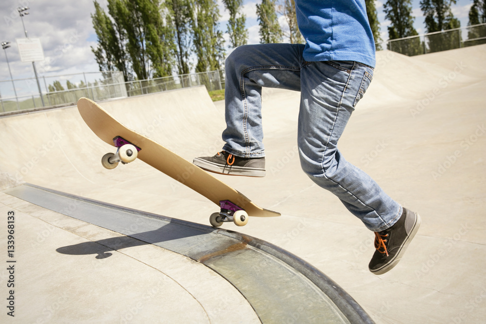 Low section of boy skateboarding on ramp Low section of boy skateboarding on ramp