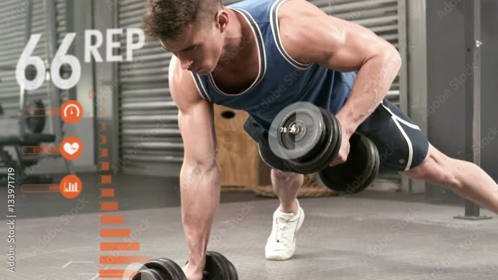 Athlete performing push ups with dumbbell against the animated background Athlete performing push ups with dumbbell against the animated background