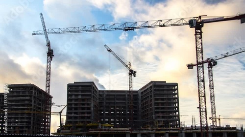 Cranes working on construction of the housing estate in former industrial zone time lapse

