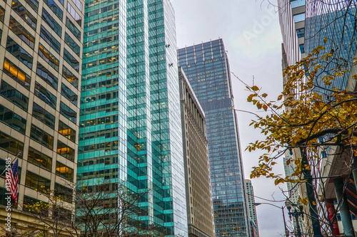 Window washers work high above the ground on a skyscraper in downtown Chicago