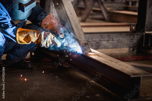 Welding steel with the technician. photo