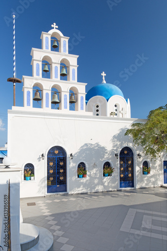 Santorini - The typicaly white-blue church ower Akrotiri (russian orthodox). photo