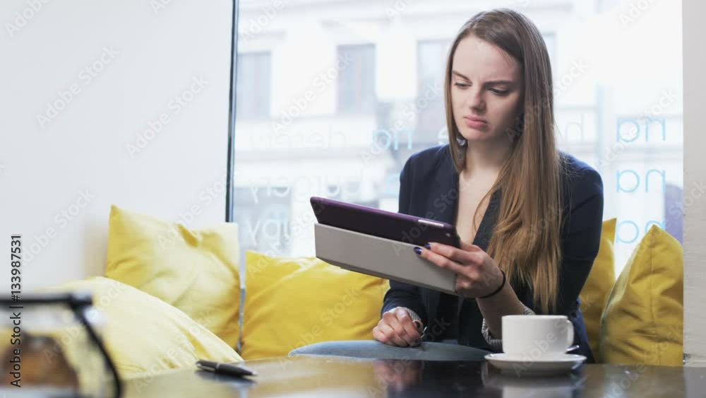 Sad Young Businesswoman in a Cafe Sad Young Businesswoman in a Cafe