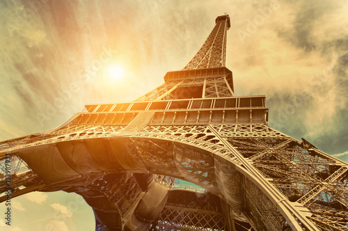 The Eiffel tower is one of the most recognizable landmarks in the world under sun light