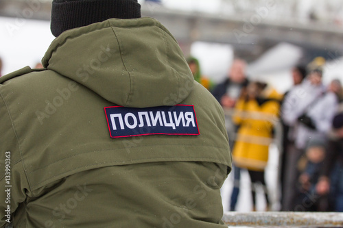 Russian police - emblem on the back OMON during Christ's baptism holiday