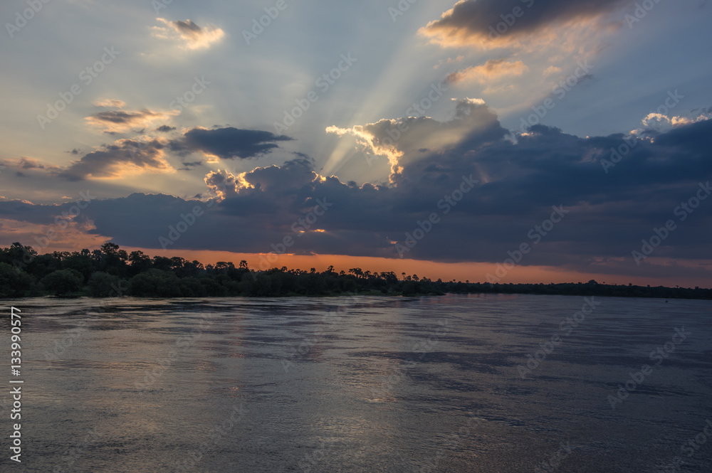 Beautiful Sunset over the Zambezi River, Zambia, The Zambezi is the fourth longest river in Africa Beautiful Sunset over the Zambezi River, Zambia, The Zambezi is the fourth longest river in Africa