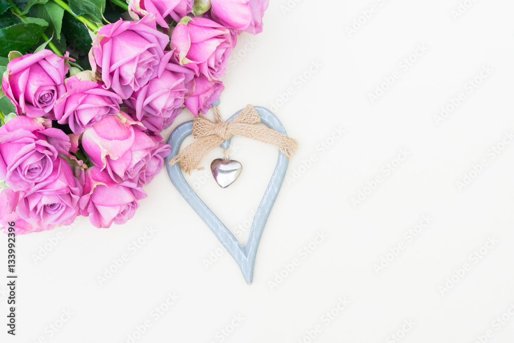 Valentines day violet roses top view flat lay scene with heart Valentines day violet roses top view flat lay scene with heart