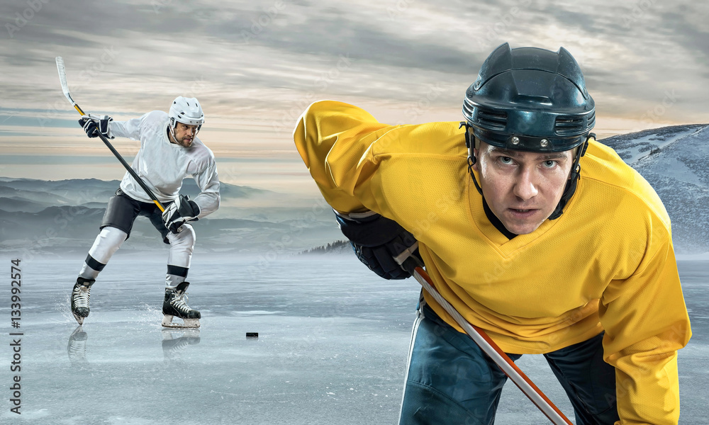 Ice hockey player on the ice in mountains StockFoto Adobe Stock