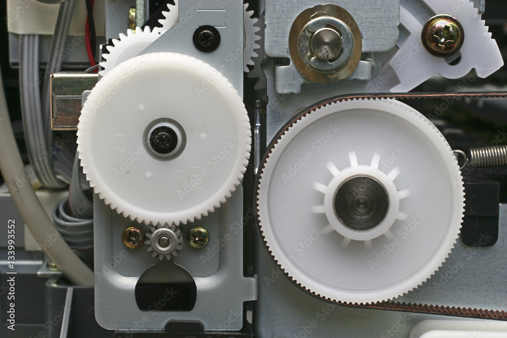 plastic and nylon cogs, drive belts and equipment inside computer printers  and disk drives. Stock Photo | Adobe Stock