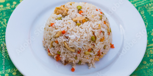 Fried rice chicken, a typical inexpensive food for travelers in South-East Asia. The photo taken in Kampot, Cambodia, 1.5$ for a dish at an open air restaurant of local hygiene standards