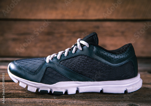 running shoes on a wooden background. sport