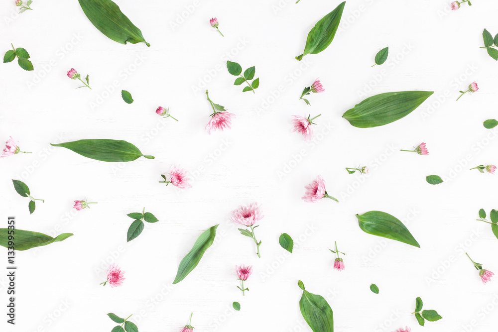 Flowers composition. Frame made of pink flowers and leaves. Top view, flat lay Flowers composition. Frame made of pink flowers and leaves. Top view, flat lay
