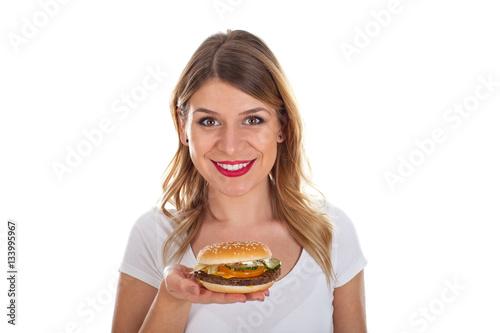 Beautiful young woman with hamburger