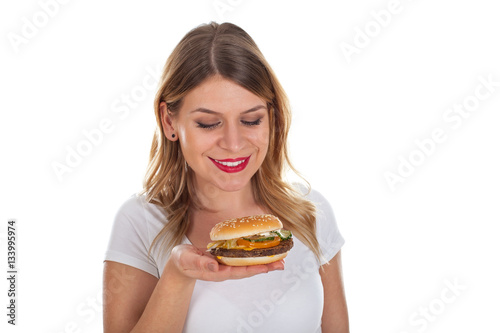 Beautiful young woman with hamburger