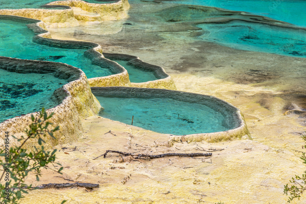 Huanglong National Park, Sichuan, China, famous for its colorful pools formed by calcite deposits. Situated at more than 3000m elevation, it is a UNESCO World heritage site