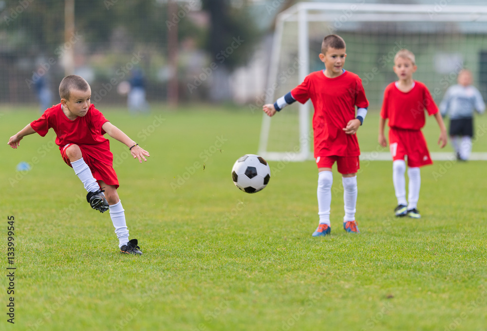  Boys kicking ball