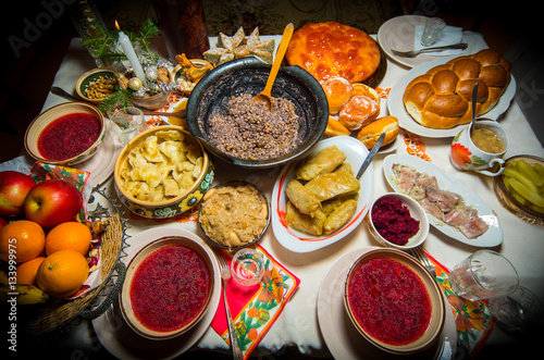 Traditional Ukrainian food.Kutya, borsch, dumplings, cabbage rolls on festive table.