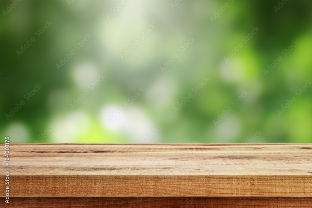 Wooden table and blur green background. Wooden table and blur green background.