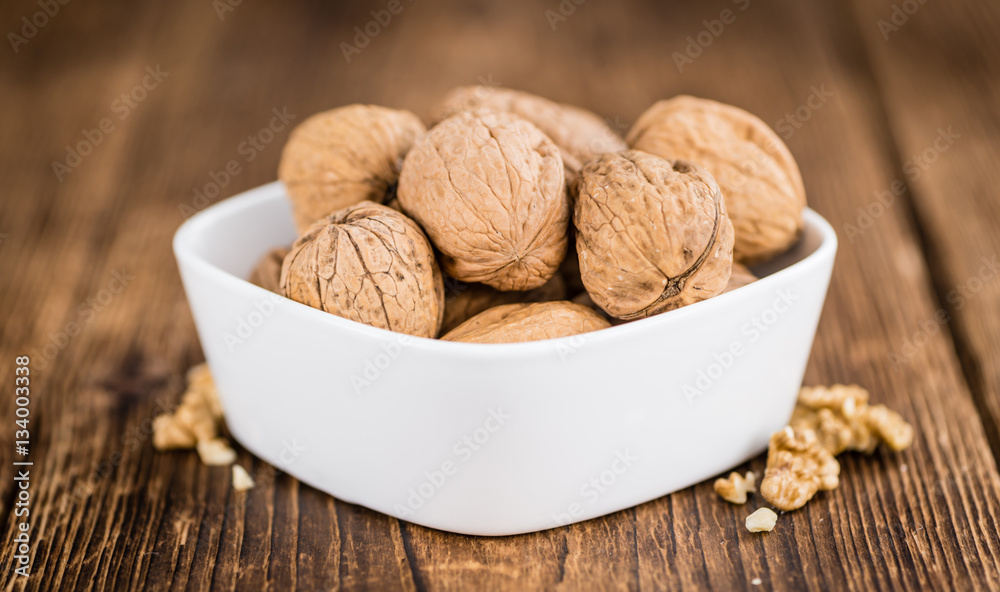 Whole Walnuts on wooden background (selective focus) Whole Walnuts on wooden background (selective focus)