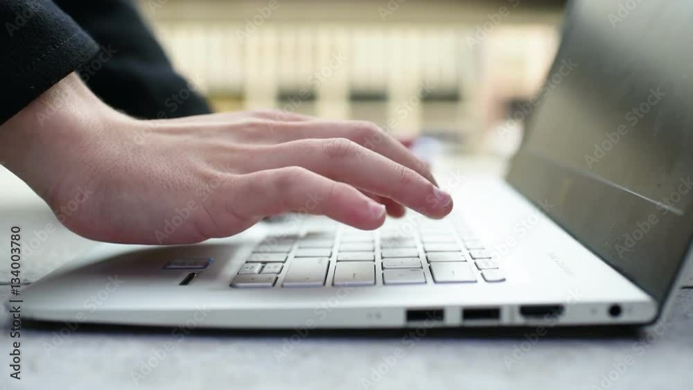 Close up on the hand of young man using computer - technology, social network, communication concept Close up on the hand of young man using computer - technology, social network, communication concept