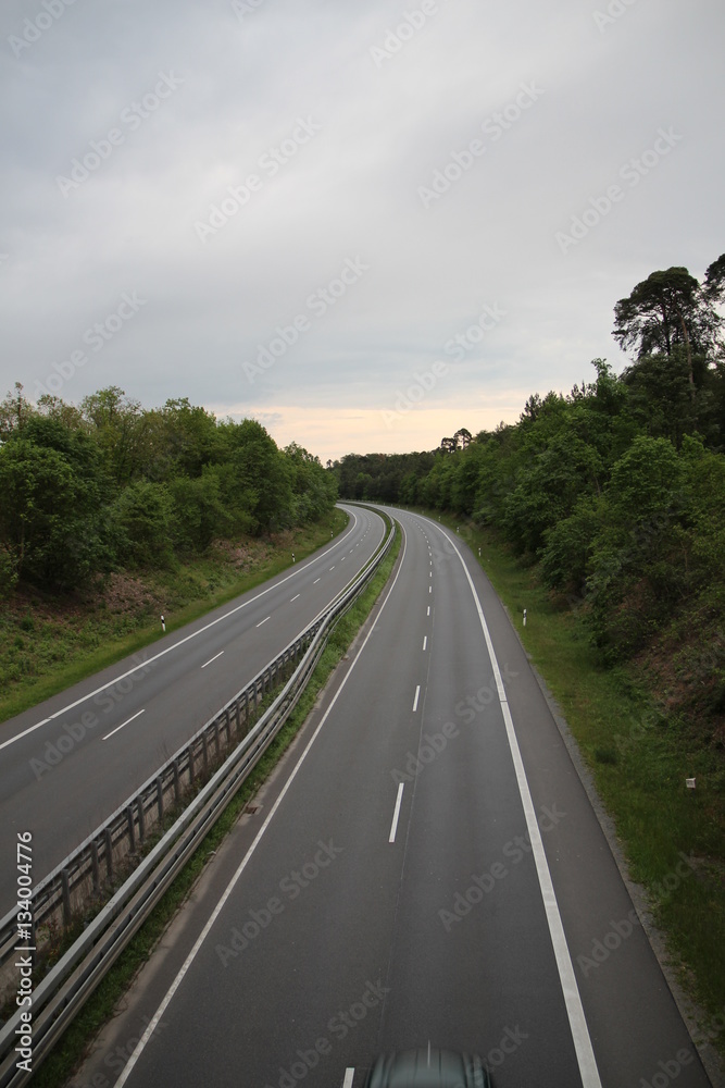 Autobahn Straße road empty Germany sky nature trees forest cars drive clouds