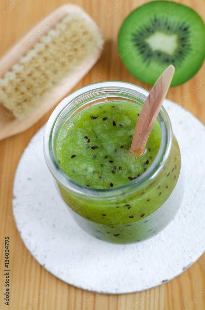 Homemade kiwi beauty mask (scrub) in a glass jar. DIY cosmetics. Homemade kiwi beauty mask (scrub) in a glass jar. DIY cosmetics.