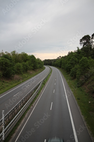 Autobahn Straße road empty Germany sky nature trees forest cars drive clouds © Daniel