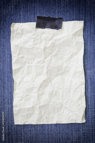 Note paper crumpled of empty and copy space on Denim background.