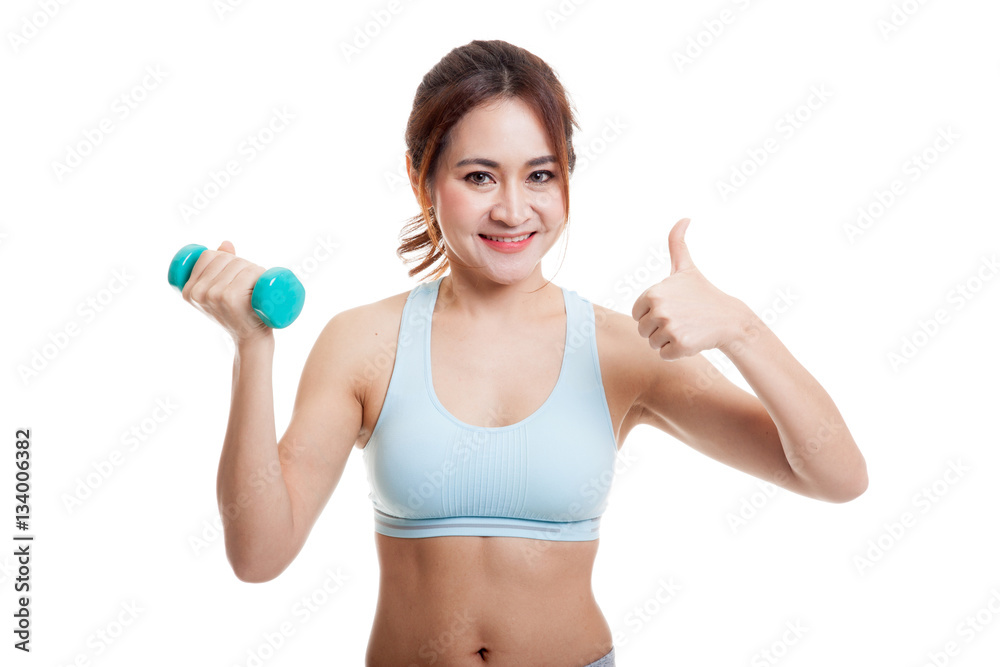 Beautiful Asian healthy girl thumbs up with dumbbell. Beautiful Asian healthy girl thumbs up with dumbbell.