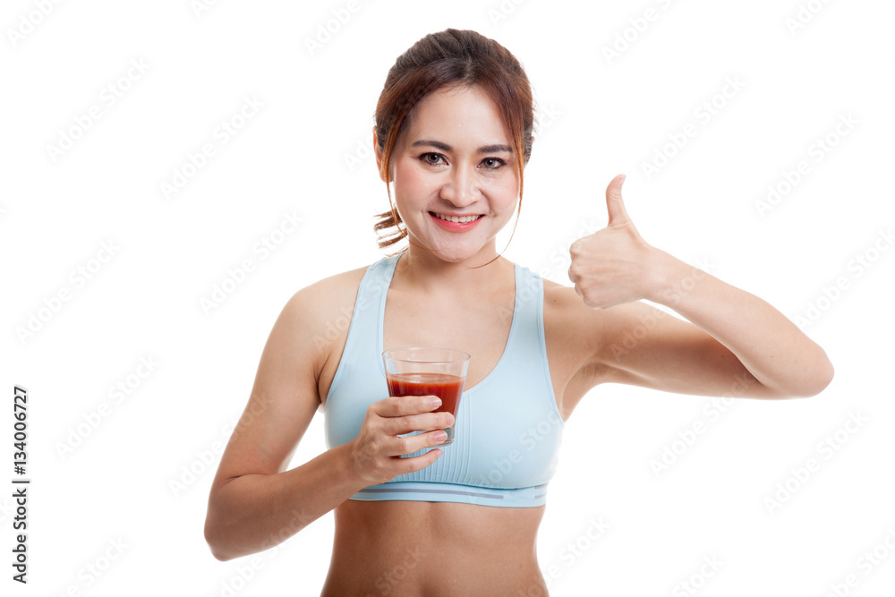 Beautiful healthy Asian girl thumbs up with tomato juice. Beautiful healthy Asian girl thumbs up with tomato juice.