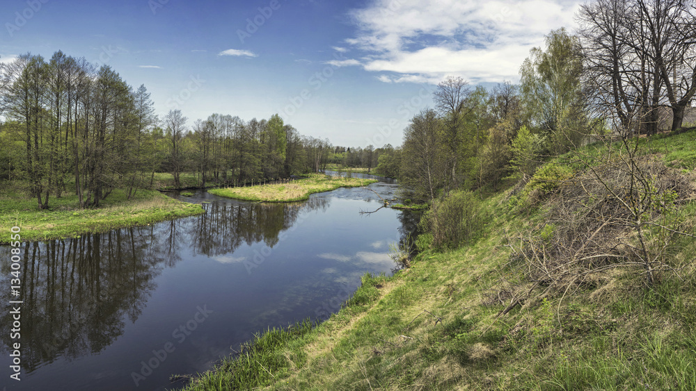 Spring river flowing in a valley. Stitched Panorama Spring river flowing in a valley. Stitched Panorama