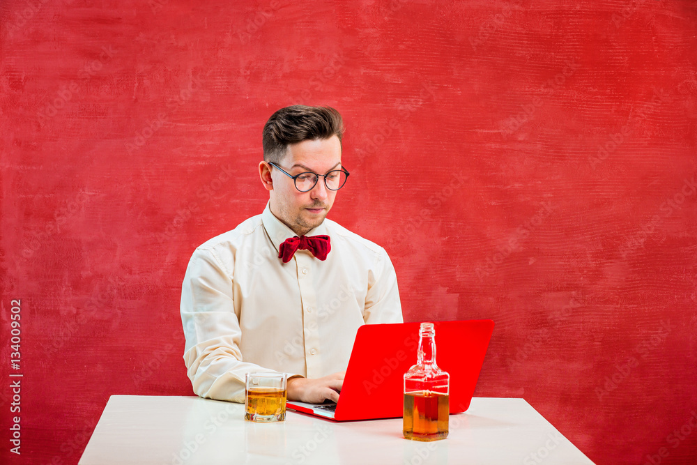Young funny man with laptop at St. Valentine's Day Young funny man with laptop at St. Valentine's Day