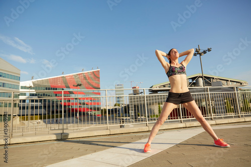 Run woman exercising with urban background of skyscrapers skyline