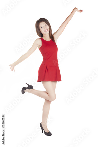 Young Woman wearing a red dress isolated on a white background