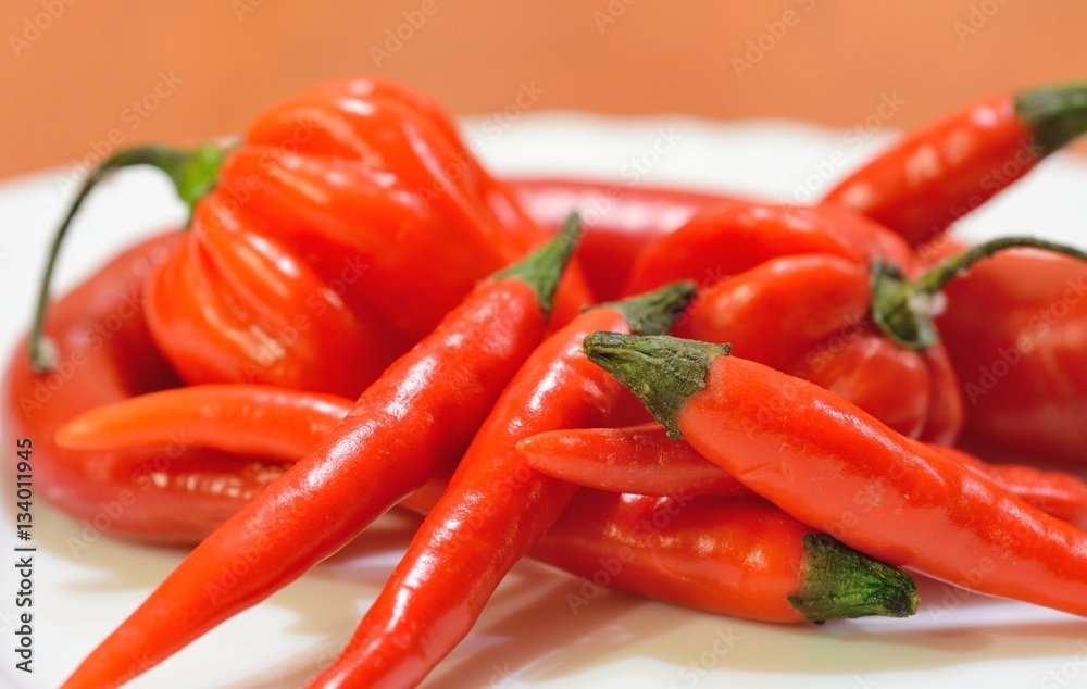 Heap of mixed fresh red hot chili peppers.