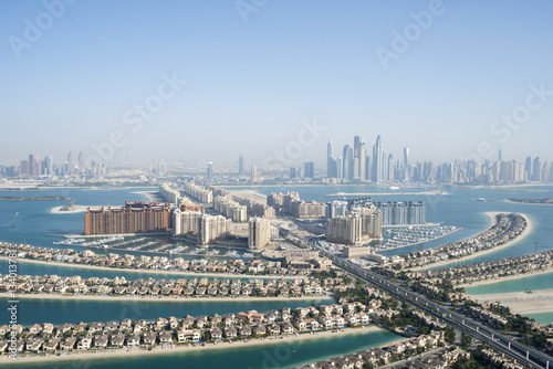 Photography Aerial view of the famous palm shaped artificial island in Dubai, United Arab Em