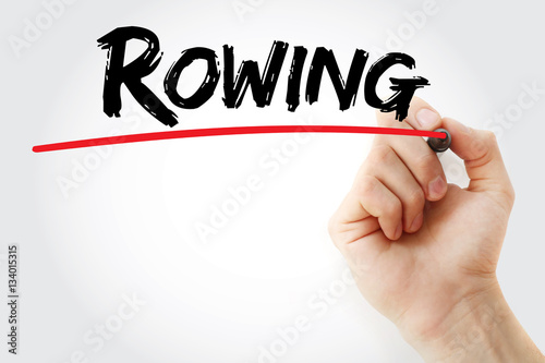 Hand writing Rowing with marker, sport concept background photo