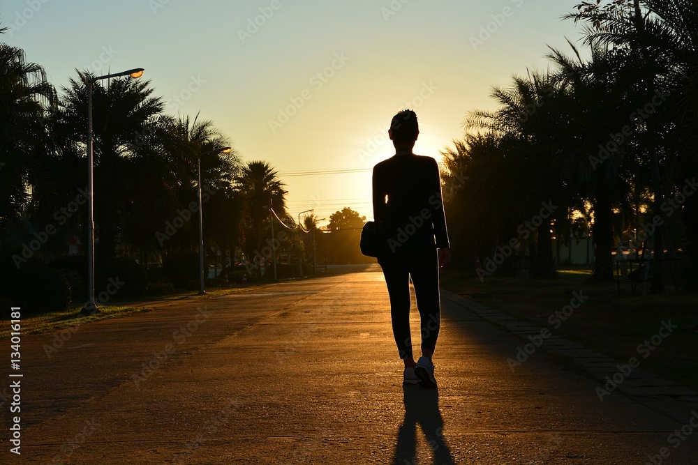 Women dressed in black and morning sun on the street. Shooting backlit Women dressed in black and morning sun on the street. Shooting backlit