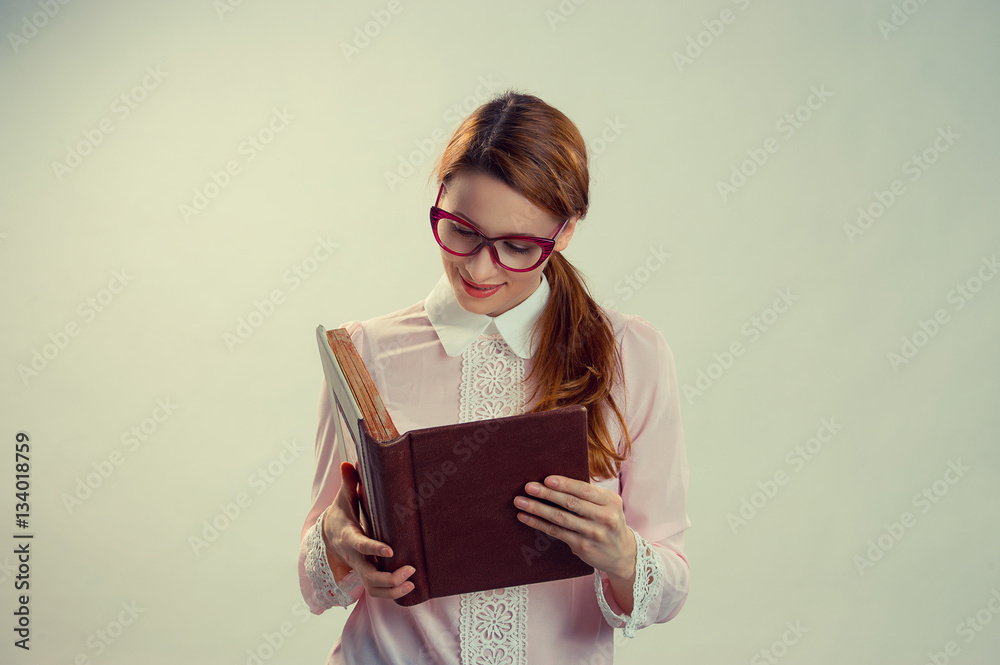 long-haired girl reading a the book, a student in isolation on a green gray background long-haired girl reading a the book, a student in isolation on a green gray background
