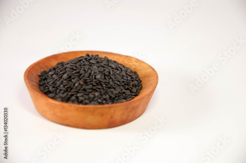 The sesame in wooden bowl. Black sesame.