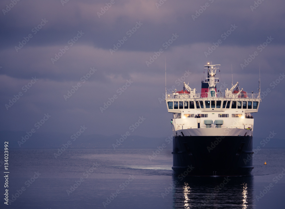 Ferry Arriving At Dusk