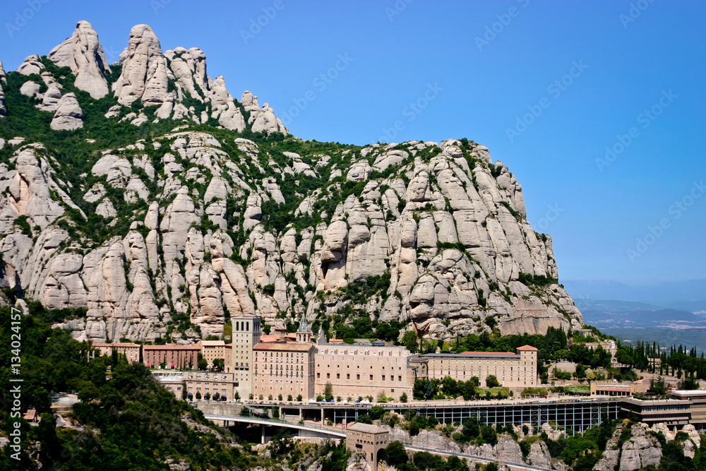 Panoramic view of the architectural complex of the Benedictine monastery at Montserrat mountain in Spain.