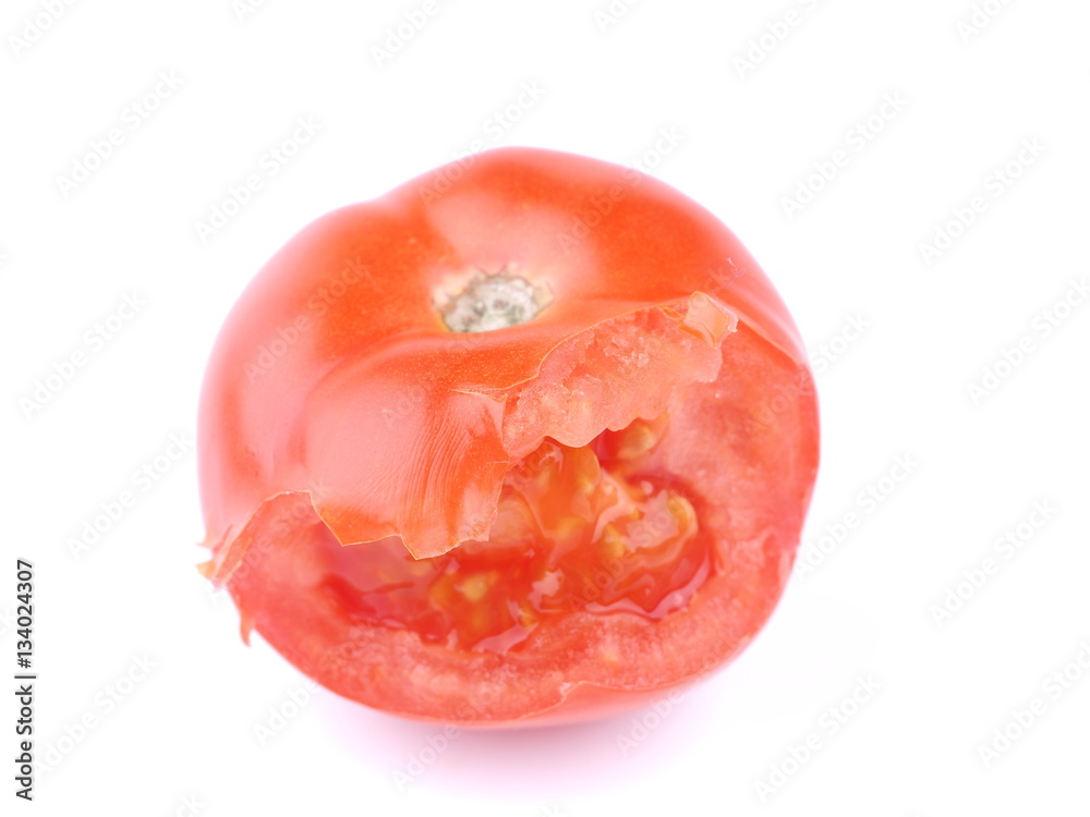 bitten red tomato on a white background bitten red tomato on a white background