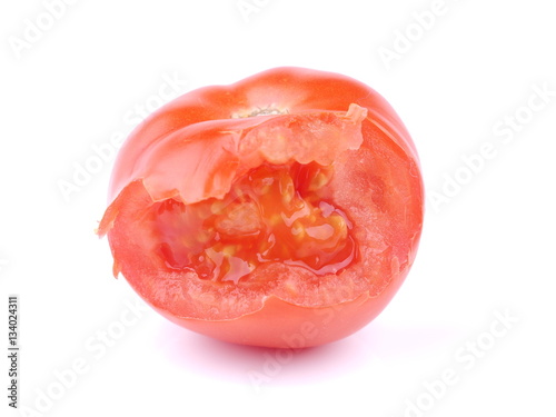 bitten red tomato on a white background
