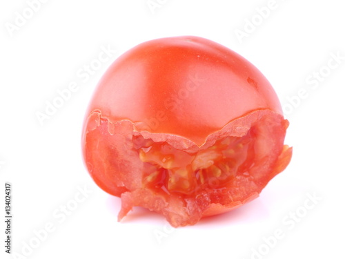 bitten red tomato on a white background