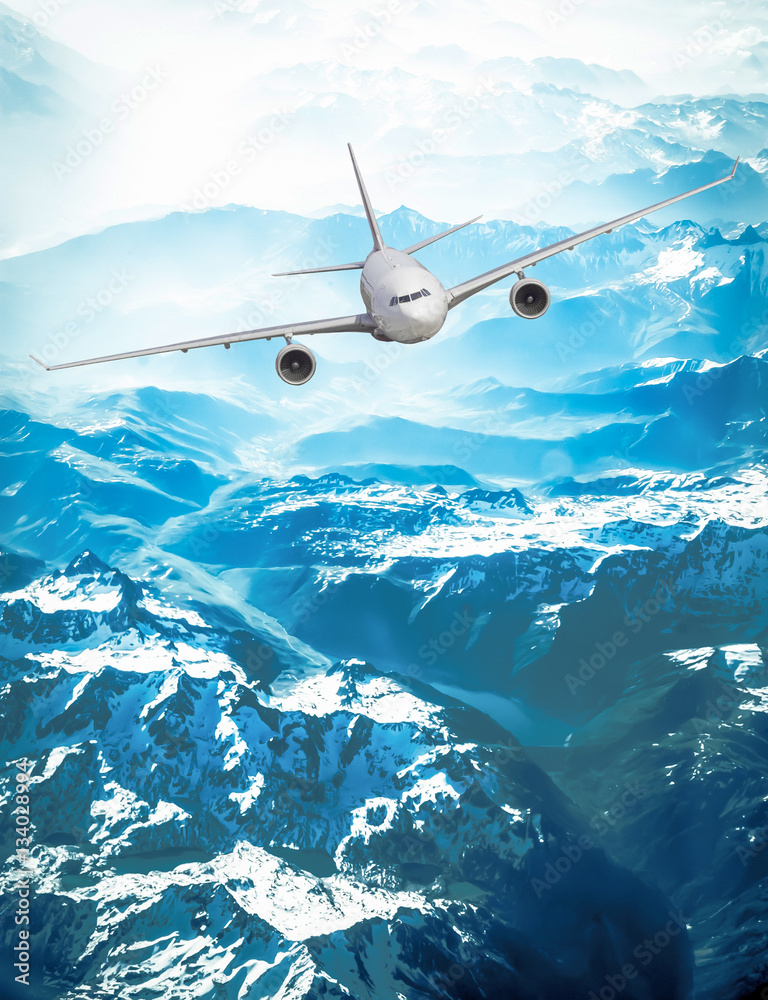 Obraz premium airliner flying above clouds. Passenger airplane