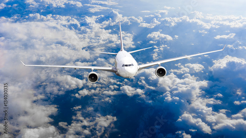 Billede på lærred Airplane fly over clouds. Transportation travel concept