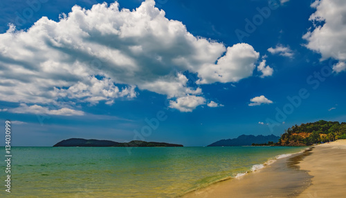 Beautiful exotic beach with the azure sea and cloudy sky in Langkawi Island, Malaysia.