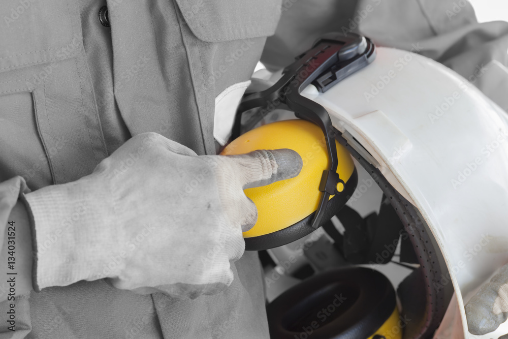 Safety concept, Worker showing finger index to safety helmet Safety concept, Worker showing finger index to safety helmet